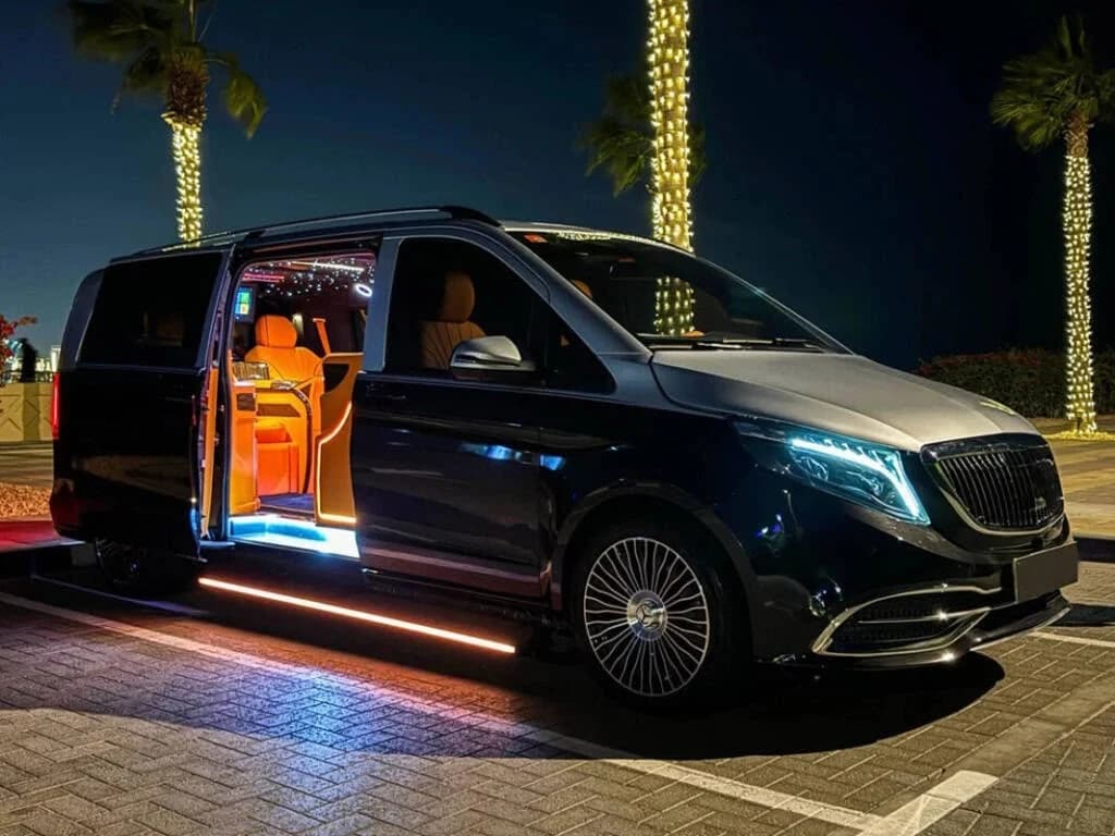 Black VIP Luxury Vito with its door open at night